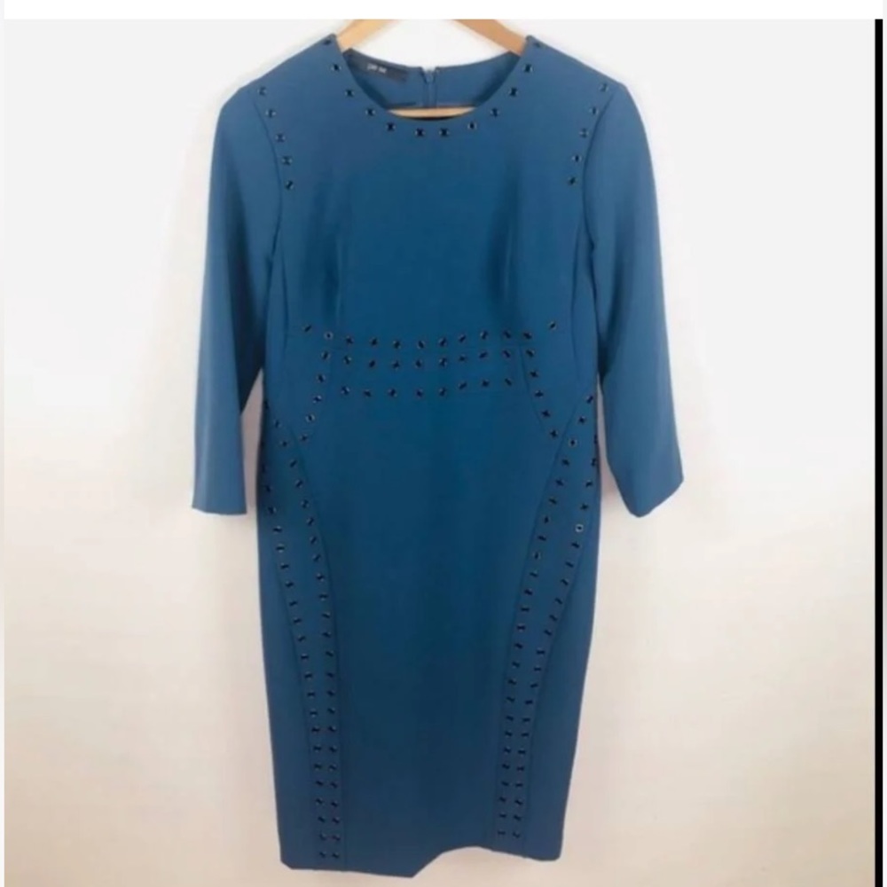 Worn in Fashion show once Blue Sheath Dress Grommet Details. W/34 Sleeves Size 0